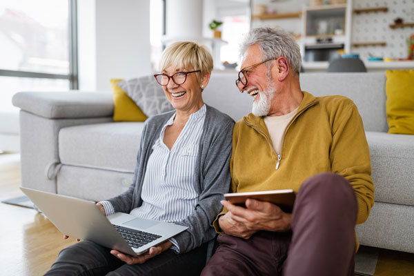Image: /uploads/blog/2024/happy-couple-sat-on-the-floor-in-front-of-sofa.jpg